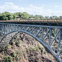234 FacebookHeader ZWE MATN VictoriaFalls 2016DEC05 075  The 200 metre (650 foot) Victoria Falls Road, Rail & Foot Bridge sits over the Zambezi River and marks the international border between Zimbabwe and Zambia.   I just liked the timeless architecture that was the brainchild of Cecil Rhodes, which was part of his grand and unfulfilled Cape to Cairo railway scheme. — @ Victoria Falls, Zimbabwe. : 2016, 2016 - African Adventures, Africa, Date, December, Eastern, Matabeleland North, Month, Places, Trips, Victoria Falls, Year, Zimbabwe